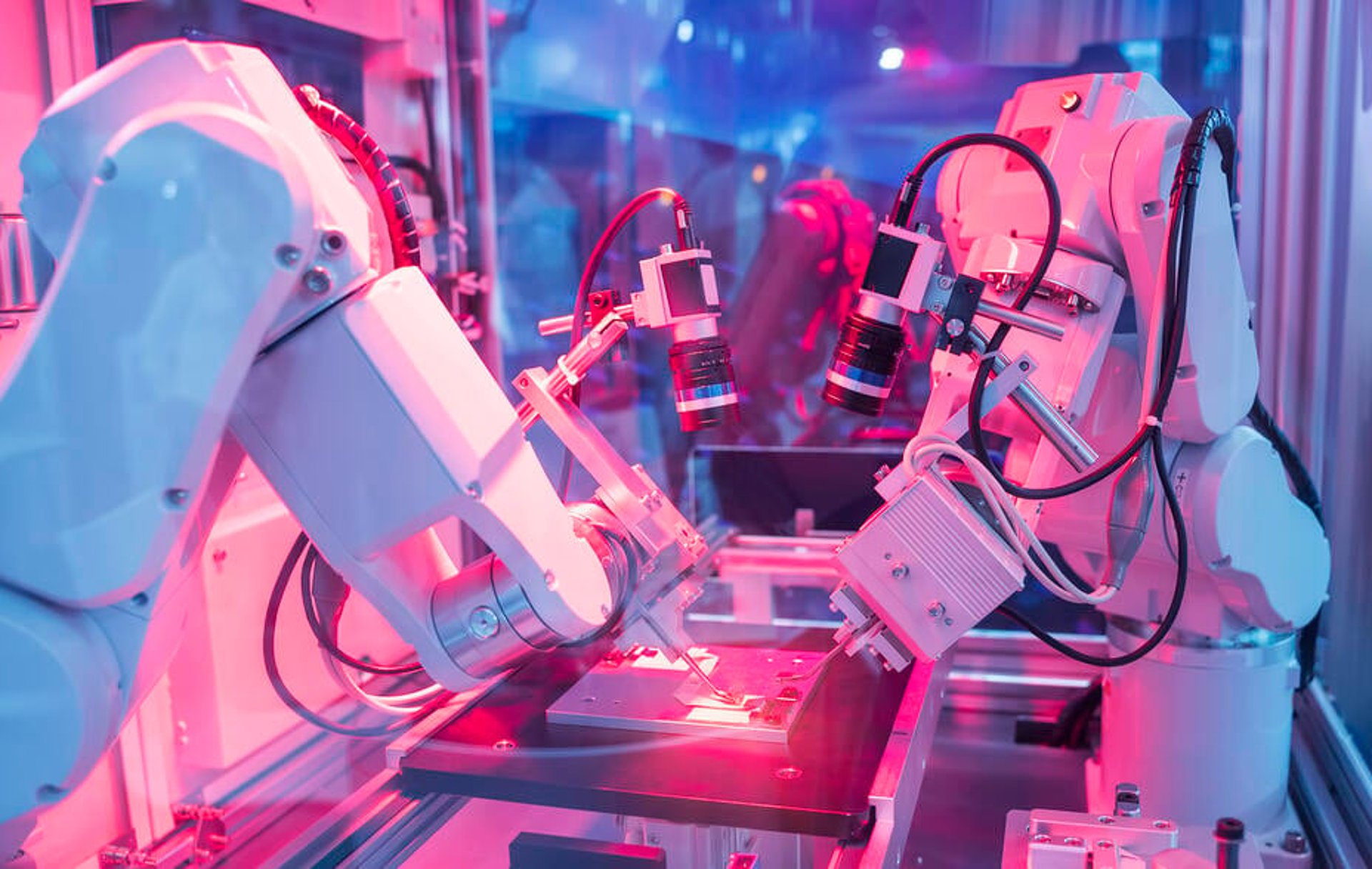  Smart robots examine products being manufactured on an assembly line.