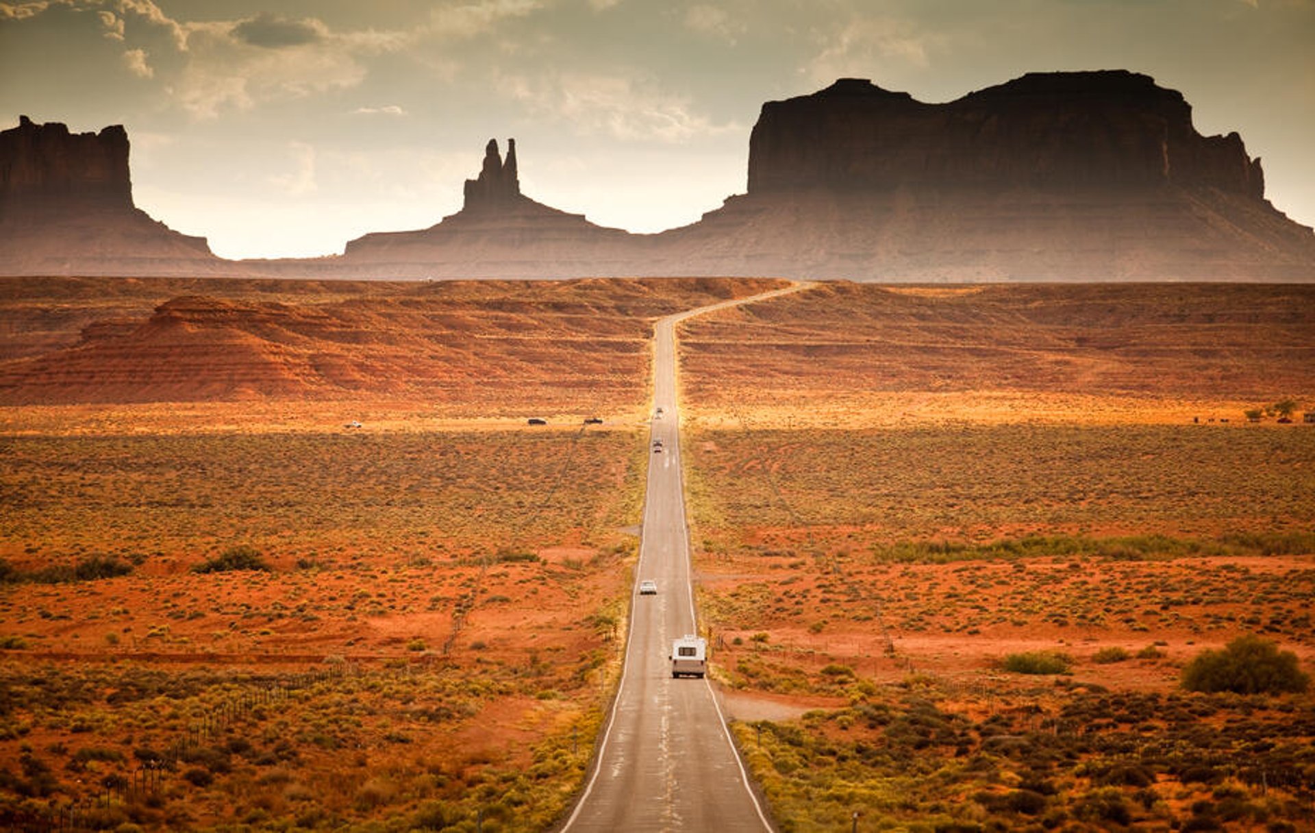 Driving down the highway in the southwest USA red rock landscape, near Monument Valley.