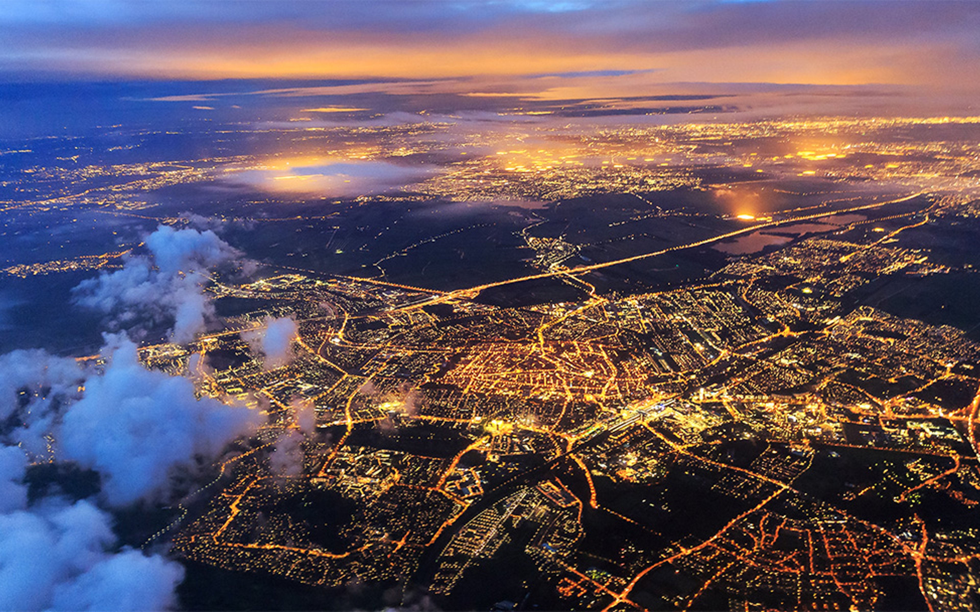 Aerial cityscape view of the city of Leiden, the Netherlands, after sunset at night.